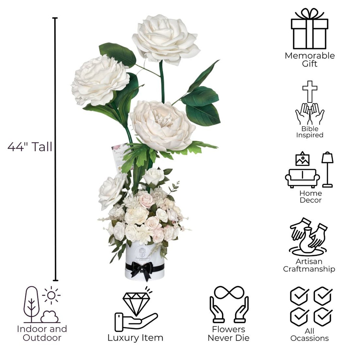 Clean white background product infographic showcasing 44-inch-tall white-ivory floral arrangement with black line art icons and captions highlighting features. Three oversized white-cream blooms resembling roses-peonies rise on long green stems with dark green leaves: one at very top, one to left, one slightly lower on right. Small card-tag attached to one stem. Dense bouquet of many smaller white-ivory roses with bits of greenery at base. Flowers in white cylindrical hatbox-style container wrapped with bla
